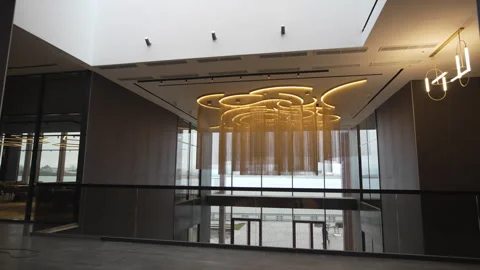 Stylish location with panoramic windows and designer lamp Stock Footage 317154403