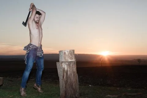 The stylish lumberjack at work. Stock Photos