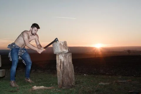 The stylish lumberjack at work. Stock Photos