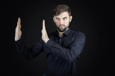 Stylish man with beard on black background Stock Photos