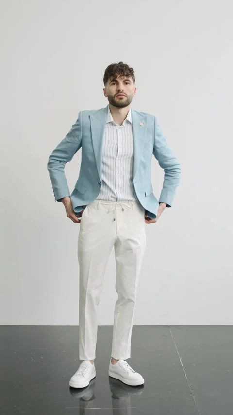 Stylish man in blue jacket and white pants Video stock 277568510