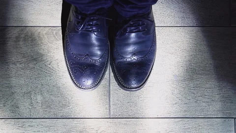 A stylish man in blue leather elegant men's shoes Stock Footage 124322031