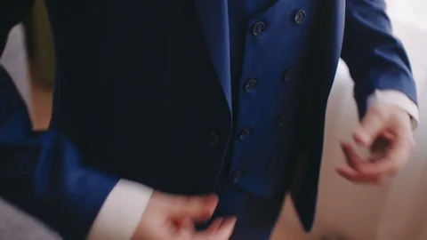 Stylish man buttons his jacket. close-up Stock Footage 105092778