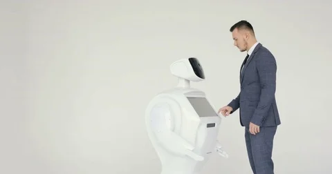 A stylish man communicates with a robot, presses a plastic mechanical arm to the Video stock 80422486