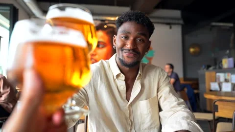 Stylish man enjoying craft beer in a modern pub Stock Footage 310523441