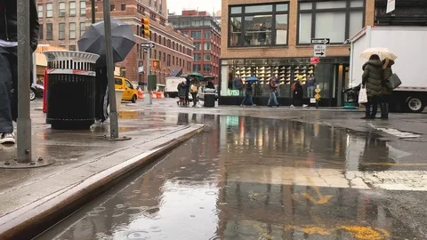 Stylish Man Jumps Rain Puddle Crossing Street in Manhattan Stock Footage
