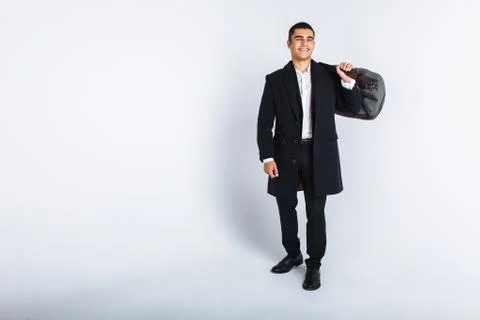 Stylish man in Studio on a white background, with a bag for travel, isolated, Stock Photos