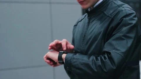 Stylish Man Using Smart Watch Standing Near the Office. Stock Footage 61179407