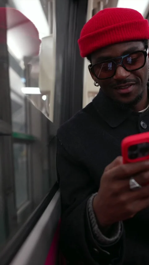 Stylish man using smartphone commuting on a train Stock Footage 323069973