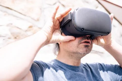 Stylish man using virtual reality glasses for the first time Stock Photos