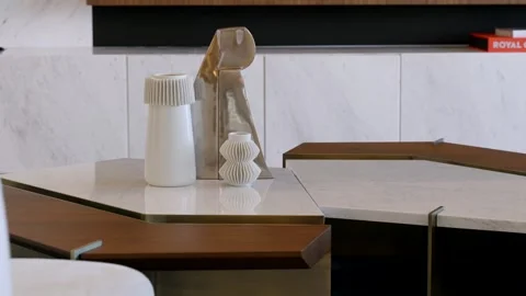 Stylish marble table of extraordinary design with modern jars on glossy surface Stock Footage 245770372