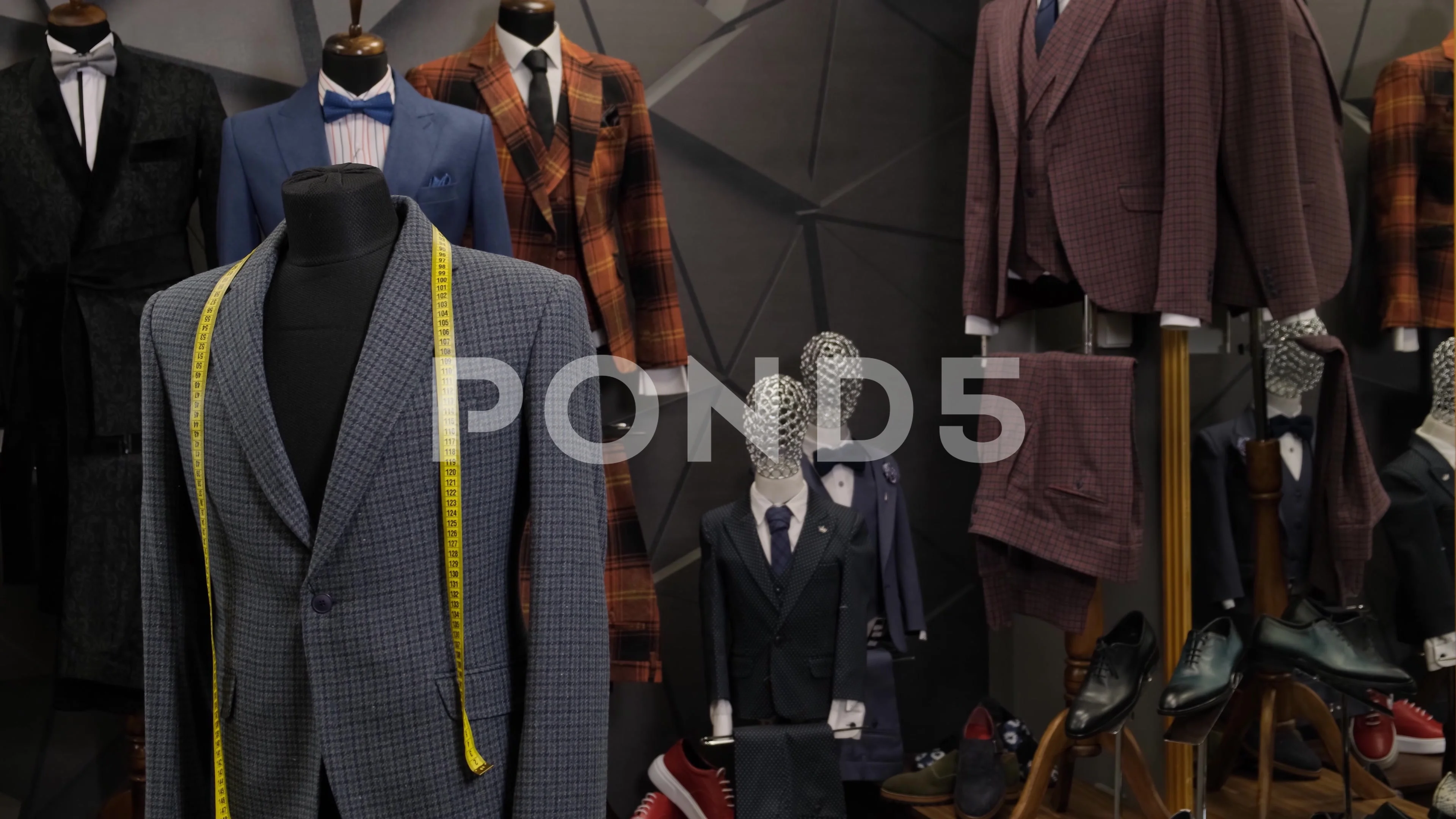 Male mannequins in a shop. Sale of clothes , suit , sweaters