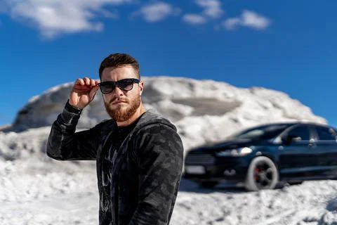 Stylish model posing with car. Young handsome fashionable businessman. Stock Photos