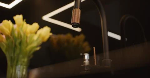 Stylish modern black themed kitchen with a sink Stock Photos