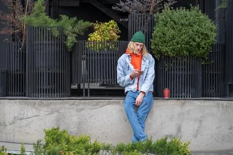 Stylish modern guy addicted to internet, social networks, spending time outdoors Stock Photos