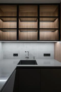 Stylish modern kitchen corner with under cabinet lighting Stock Photos