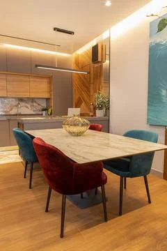 Stylish modern kitchen interior, studio. Large table with velvet chairs. Zone Stock Photos