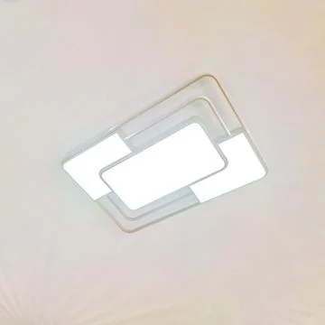 Stylish Modern LED Ceiling Light Fixture Providing Bright Contemporary Inte.. Stock Photos