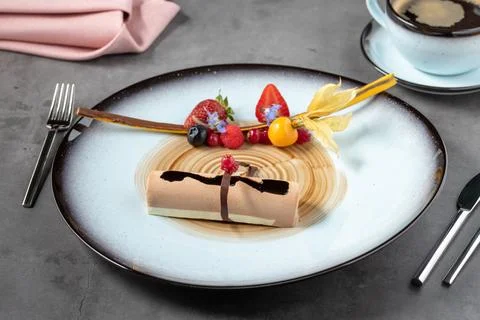 Stylish modern presentation of fruit chocolate mousse or semi-frozen parfait Stock Photos