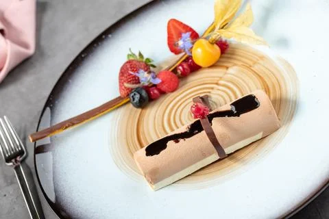 Stylish modern presentation of fruit chocolate mousse or semi-frozen parfait Stock Photos