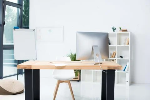 Stylish modern workplace with computer in office Stock Photos