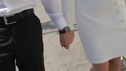 Stylish modern young couple walks around the city holding hands. Stock Footage 121925129