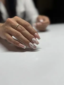 Stylish Neutral Marble-Patterned Manicure with Rings Stock Photos