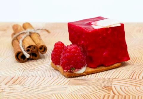 Stylish new creative raspberry cake on a wooden background Stock Photos