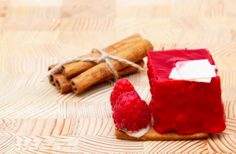 Stylish new creative raspberry cake on a wooden background Stock Photos