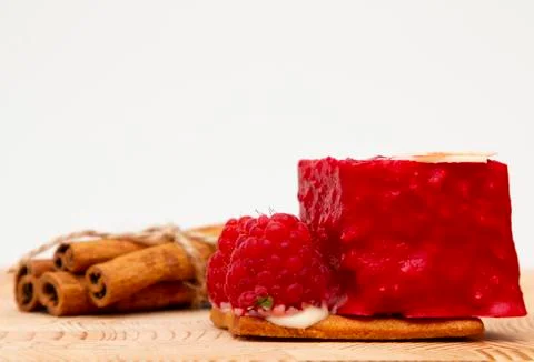 Stylish new creative raspberry cake on a wooden background Stock Photos