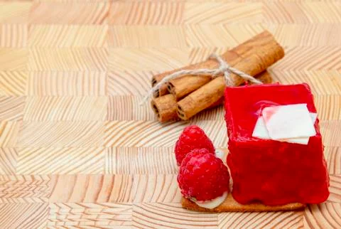 Stylish new creative raspberry cake on a wooden background Stock Photos
