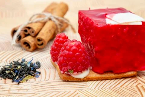 Stylish new creative raspberry cake on a wooden background Stock Photos