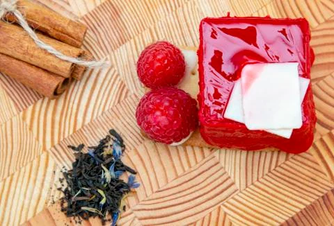 Stylish new creative raspberry cake on a wooden background Stock Photos