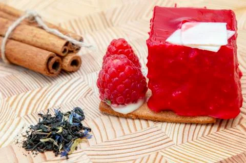 Stylish new creative raspberry cake on a wooden background Stock Photos