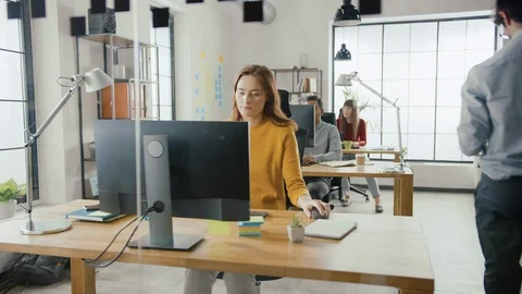 In Stylish Open Space Office: Diverse Group of Business Professionals Use PC Stock Footage 112931368