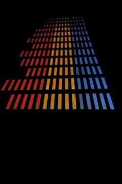 Stylish panel of pixels, neon with blue or green, yellow, red, equalizer in dark Stock Photos