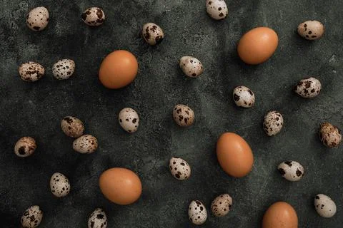 Stylish pattern with Easter eggs isolated on dark gray background. Flat lay,  Stock Photos