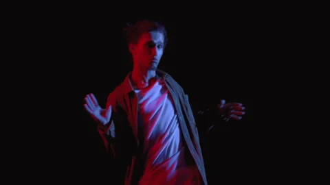 Stylish Portrait of Young Man Dancing in Neon Lighting Close Up. Modern Musical Stock Footage 199478877