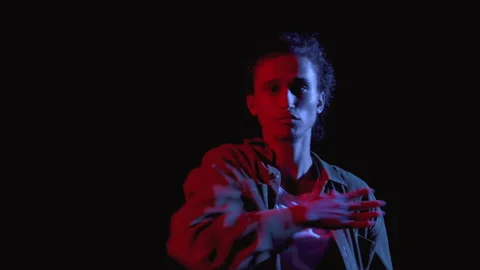 Stylish Portrait of Young Man Dancing in Neon Lighting Closeup. Modern Musical D Stock Footage 199478904
