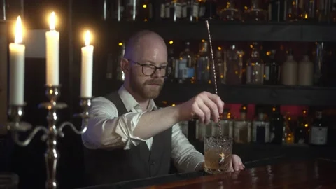 Stylish Professional Barman Preparing Old Fashioned Whiskey. Stock-Footage 131544559
