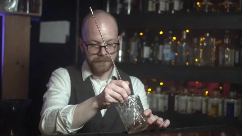 Stylish Professional Barman Preparing Old Fashioned Whiskey. Stock Footage 131544650