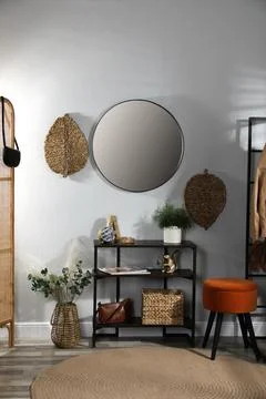 Stylish room interior with console table and beautiful decor elements Stock Photos