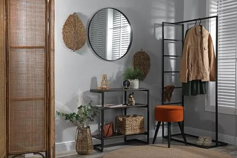 Stylish room interior with console table and beautiful decor elements Stock Photos