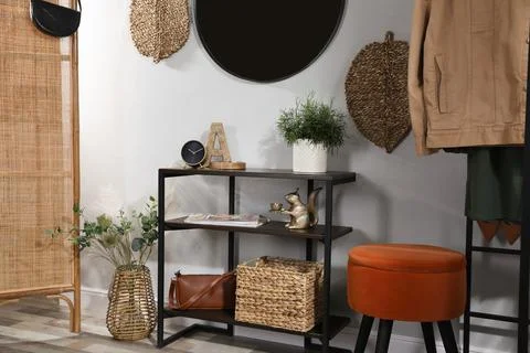 Stylish room interior with console table and beautiful decor elements Stock Photos