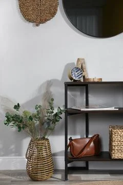 Stylish room interior with console table and beautiful decor elements Stock Photos