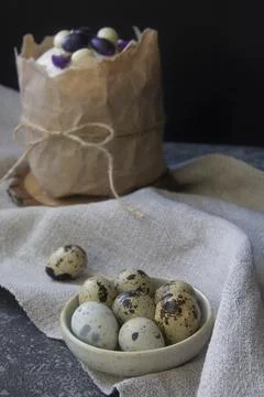 Stylish rustic spring decoration. Breakfast with Easter cake and quail eggs. Stock Photos
