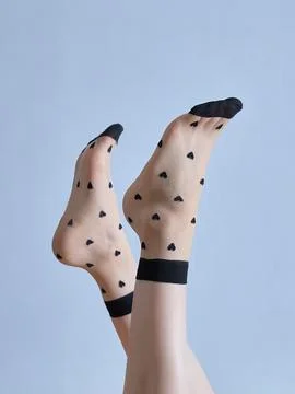Stylish Sheer Socks with Heart Pattern Display Stock Photos