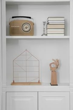 Stylish shelves with different decor elements. Interior design Stock Photos