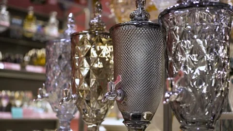 Stylish silver samovars stand in a row on the shop window. 스톡 동영상 276828452