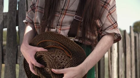 Stylish slim guy wearing rustic country style jeans with suspenders and plaid Stock Footage 264508690